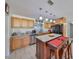 Bright kitchen with stainless steel appliances and island with seating, perfect for entertaining at 4116 Ohio Ave, Tampa, FL 33616