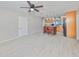 Open floor plan with kitchen island, wood cabinets, and stainless steel refrigerator at 4116 Ohio Ave, Tampa, FL 33616