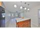 Living room view with kitchen island, creating an open and connected living space at 4116 Ohio Ave, Tampa, FL 33616