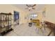 Bright living room with neutral walls, tile floors, ceiling fan, and updated furniture, creating a cozy atmosphere at 4116 Ohio Ave, Tampa, FL 33616