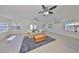 Spacious living room with vaulted ceilings, ceiling fans, and lots of natural light at 4116 Ohio Ave, Tampa, FL 33616