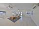 Open living room with bright wood flooring, lots of natural light and neutral decor at 4116 Ohio Ave, Tampa, FL 33616
