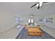 Bright living room featuring wood-look floors, neutral walls, comfortable seating and natural light at 4116 Ohio Ave, Tampa, FL 33616