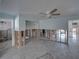 Under construction living room with tiled floors and exposed framing at 4326 Huntington Ne St, St Petersburg, FL 33703