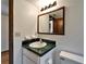 Bathroom with a single sink, mirror, and toilet at 4501 Keene Rd, Plant City, FL 33565