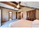 Bedroom showcases a king-sized bed, wooden closet, with easy access to a bathroom to ensure a comfortable living space at 4501 Keene Rd, Plant City, FL 33565