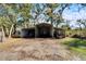Outside view of the multiple carport on the property with farm equipment and vehicles stored inside at 4501 Keene Rd, Plant City, FL 33565