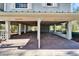 Spacious covered carport with brick flooring, providing ample parking and shelter at 4501 Keene Rd, Plant City, FL 33565