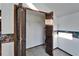 Open closet with wooden bi-fold doors and wire shelving at 4501 Keene Rd, Plant City, FL 33565