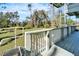 Wooden deck overlooking well-manicured lawn and wooded area at 4501 Keene Rd, Plant City, FL 33565