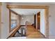 The house entryway has wooden accents, stairs to the basement, and wood-grain floors that create a warm and inviting welcome at 4501 Keene Rd, Plant City, FL 33565