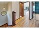 Hallway with wood floors and wooden railing at 4501 Keene Rd, Plant City, FL 33565