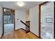 Hallway leading to bedroom and bathroom with wood floors at 4501 Keene Rd, Plant City, FL 33565