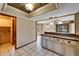 Kitchen with breakfast bar and views to the dining area and laundry room at 4501 Keene Rd, Plant City, FL 33565