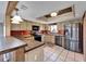 Bright kitchen with wood cabinets, stainless steel appliances, and tiled backsplash at 4501 Keene Rd, Plant City, FL 33565