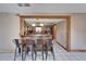 Kitchen bar with seating and wood trim at 4501 Keene Rd, Plant City, FL 33565