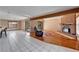 Spacious living room with hardwood floors, a brick fireplace, and natural light at 4501 Keene Rd, Plant City, FL 33565