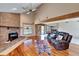 Inviting living room with vaulted ceilings, brick fireplace, and sliding barn door at 4501 Keene Rd, Plant City, FL 33565
