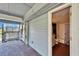 Covered brick porch leading to a bathroom and screened in porch at 4501 Keene Rd, Plant City, FL 33565