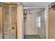 Shower with glass door and stone tile floor at 4501 Keene Rd, Plant City, FL 33565