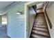 Side entrance with wooden staircase leading to the upper level of the home at 4501 Keene Rd, Plant City, FL 33565