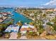 Waterfront home with pool and lush landscaping, solar panels at 529 80Th Ave, St Pete Beach, FL 33706