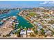 Aerial perspective of a house by the water, featuring a pool and dock at 529 80Th Ave, St Pete Beach, FL 33706