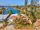 House with driveway, canal view, and lush landscaping at 529 80Th Ave, St Pete Beach, FL 33706
