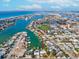 Aerial view of canal-front home with private pool at 529 80Th Ave, St Pete Beach, FL 33706