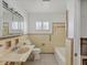 Bathroom with tub, sink, and toilet; ideal for a remodel at 529 80Th Ave, St Pete Beach, FL 33706