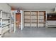 Garage with shelving, workbench, and a small bathroom at 529 80Th Ave, St Pete Beach, FL 33706