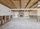 Spacious living room with fireplace and wood beams, currently undergoing renovation at 529 80Th Ave, St Pete Beach, FL 33706