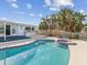 Large, kidney-shaped pool with a built-in spa at 529 80Th Ave, St Pete Beach, FL 33706