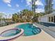 Lush landscaping surrounds this inviting pool and spa at 529 80Th Ave, St Pete Beach, FL 33706