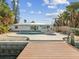 Inviting kidney-shaped pool with spa and waterfront access at 529 80Th Ave, St Pete Beach, FL 33706