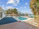 Inviting pool area with canal views and a large deck at 529 80Th Ave, St Pete Beach, FL 33706