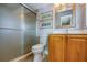 Clean bathroom with a shower/tub combo, wood vanity, and updated fixtures at 6150 Gulfport S Blvd # 413, Gulfport, FL 33707