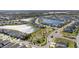 Aerial view of community with lake and park at 7122 Heron Walk Ln, Wesley Chapel, FL 33545