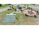 Community park with playground, basketball court, pavilion, and benches for recreation and relaxation at 7122 Heron Walk Ln, Wesley Chapel, FL 33545