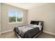 Bright bedroom with a queen bed and window at 7122 Heron Walk Ln, Wesley Chapel, FL 33545