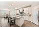 Bright kitchen features a center island with barstool seating and an adjacent dining area at 7122 Heron Walk Ln, Wesley Chapel, FL 33545