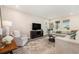 Bright living room with ample seating, perfect for entertaining and relaxation at 7122 Heron Walk Ln, Wesley Chapel, FL 33545
