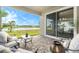 Scenic patio overlooking a serene lake, perfect for enjoying the outdoors at 7122 Heron Walk Ln, Wesley Chapel, FL 33545