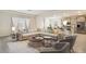 L-shaped sectional sofa and a view into the kitchen at 913 160Th E Ln, Bradenton, FL 34212
