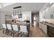 Contemporary kitchen boasts sleek white cabinetry, stainless steel appliances, and a large central island at 100 1St N Ave # 1601, St Petersburg, FL 33701