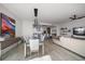 Open-concept living and dining area featuring modern decor and scenic views, with a large painting on the wall at 100 1St N Ave # 1601, St Petersburg, FL 33701