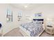 Comfortable bedroom with a queen-size bed and window seat at 10043 Crooked Creek Dr # 101, Venice, FL 34293