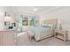 Main bedroom with large windows, plush bedding, and ample dresser storage at 10043 Crooked Creek Dr # 101, Venice, FL 34293