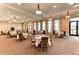 Bright and airy community dining room with multiple tables at 10043 Crooked Creek Dr # 101, Venice, FL 34293