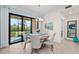 Elegant dining area with sliding glass doors to patio at 10043 Crooked Creek Dr # 101, Venice, FL 34293